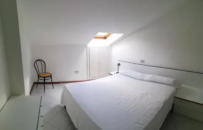 Letto o letti in una camera di Attico del sole zero undici zero uno sette lt 0787