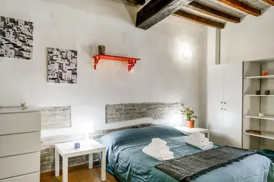 Letto o letti in una camera di GuestHost - Borgo della Posta Monolocale in Centro