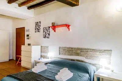Letto o letti in una camera di GuestHost - Borgo della Posta Monolocale in Centro