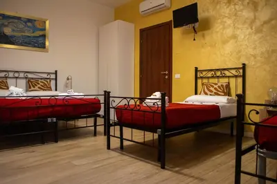 Letto o letti in una camera di Emmanueli65 fronte clinica per 4 matrimoniale e castello