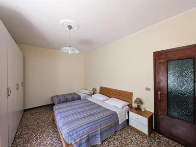 Letto o letti in una camera di Residenza Parco dei Tigli