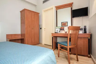 Letto o letti in una camera di Hotel Impero