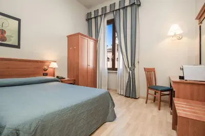 Letto o letti in una camera di Hotel Impero