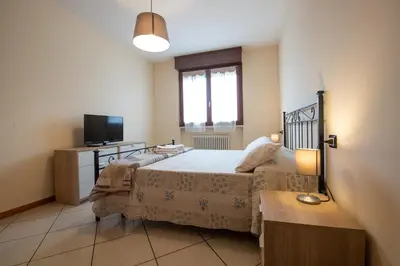 Letto o letti in una camera di Case Lanfranco Parma