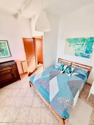 Letto o letti in una camera di Appartamento Moneglia Holidays