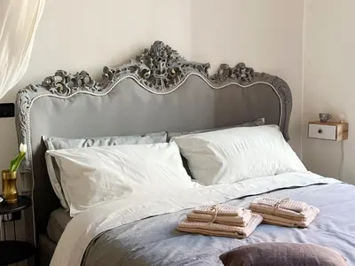 Letto o letti in una camera di Lovely nest in Parma centro