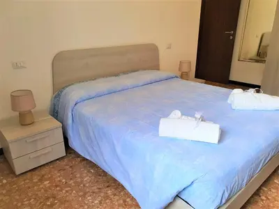 Letto o letti in una camera di Appartamento Primavera