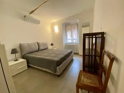 Letto o letti in una camera di Appartamento GERANIO