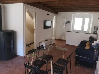 Area soggiorno di Elicriso Apartment Affittacamere