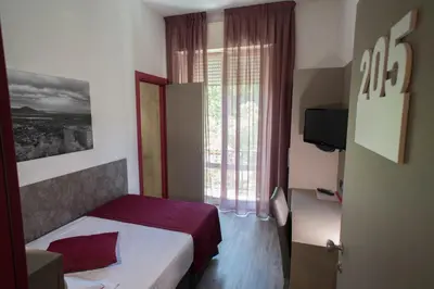 Letto o letti in una camera di Hotel Salus
