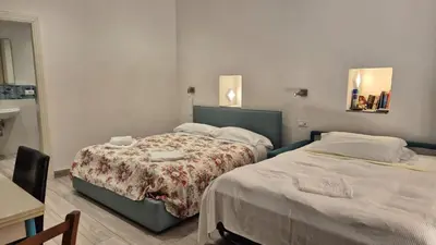 Letto o letti in una camera di Casa Isabella De Luxe Studio