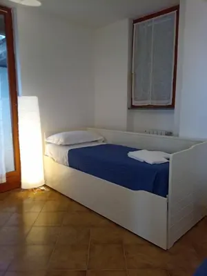 Letto o letti in una camera di VILLA ROSA CON SPLENDIDA VISTA MARE