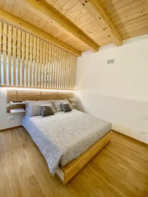 Letto o letti in una camera di MARCO APARTMENTS di Locanda da Marco