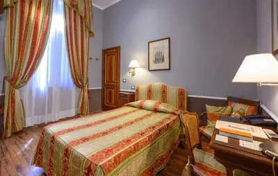 Letto o letti in una camera di Hotel Posta