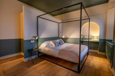 Letto o letti in una camera di Il Casale Denari - Tenuta duca Denari