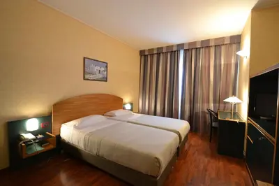 Letto o letti in una camera di Sun Hotel