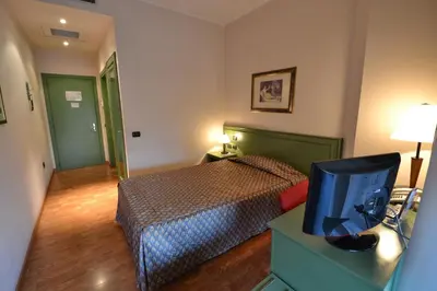 Letto o letti in una camera di Sun Hotel