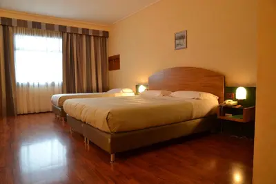 Letto o letti in una camera di Sun Hotel