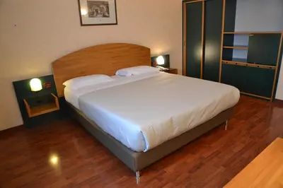 Letto o letti in una camera di Sun Hotel
