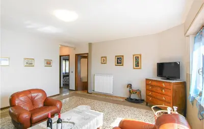 TV o dispositivi per l'intrattenimento presso Beautiful Apartment In Magliano