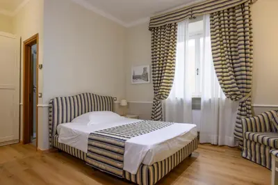 Letto o letti in una camera di Albergo Reggio