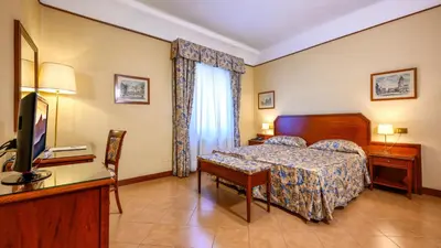 Letto o letti in una camera di Albergo Reggio
