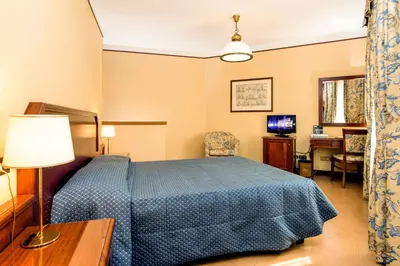 Letto o letti in una camera di Albergo Reggio