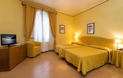 Letto o letti in una camera di Albergo Reggio