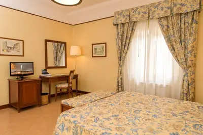 Letto o letti in una camera di Albergo Reggio