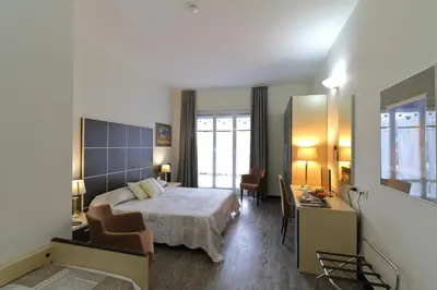 Letto o letti in una camera di Hotel Ferrari