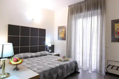 Letto o letti in una camera di Hotel Ferrari
