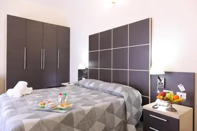 Letto o letti in una camera di Hotel Ferrari