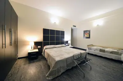 Letto o letti in una camera di Hotel Ferrari