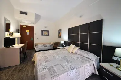 Letto o letti in una camera di Hotel Ferrari