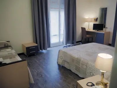 Letto o letti in una camera di Hotel Ferrari