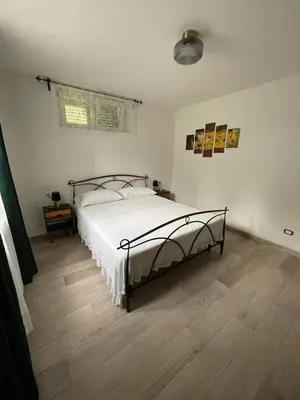 Letto o letti in una camera di L'Uliveto