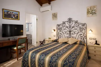 Letto o letti in una camera di Hotel Del Borgo
