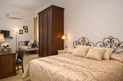 Letto o letti in una camera di Hotel Del Borgo