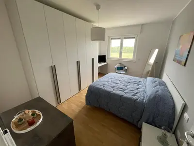 Letto o letti in una camera di Appartamento Iris