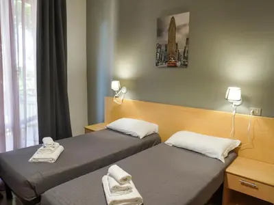 Letto o letti in una camera di Amica