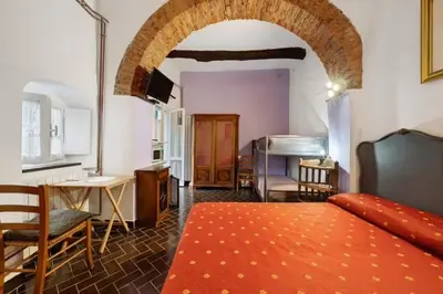 Letto o letti in una camera di VECCHIO MULINO FONTONA Ortensia