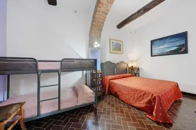 Letto o letti in una camera di VECCHIO MULINO FONTONA Ortensia