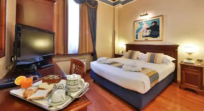 Letto o letti in una camera di Best Western Classic Hotel