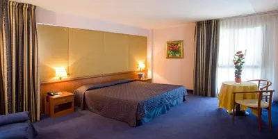 Letto o letti in una camera di Valdenza Hotel