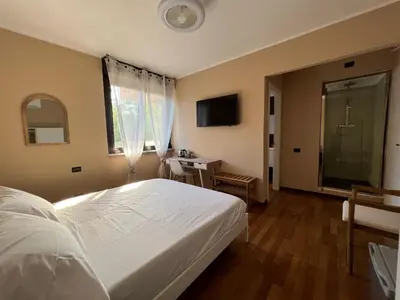 Letto o letti in una camera di La Rosa del Golfo dei Poeti