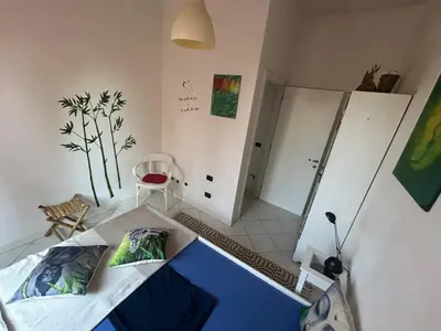 Letto o letti in una camera di Appartamento incantevole a Parma