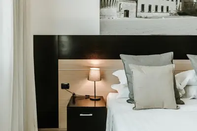 Letto o letti in una camera di Hotel Carpi