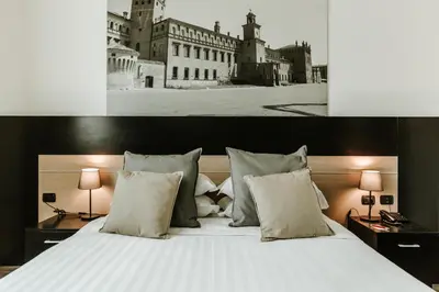 Letto o letti in una camera di Hotel Carpi