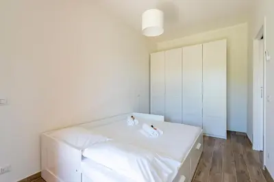 Letto o letti in una camera di JOIVY Lele Apartment with Swimming Pool
