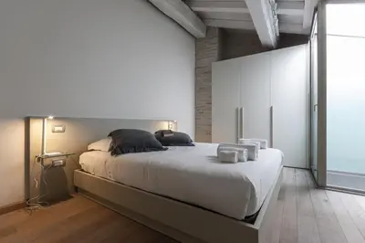 Letto o letti in una camera di Smeraldo Suite - Smart Holiday